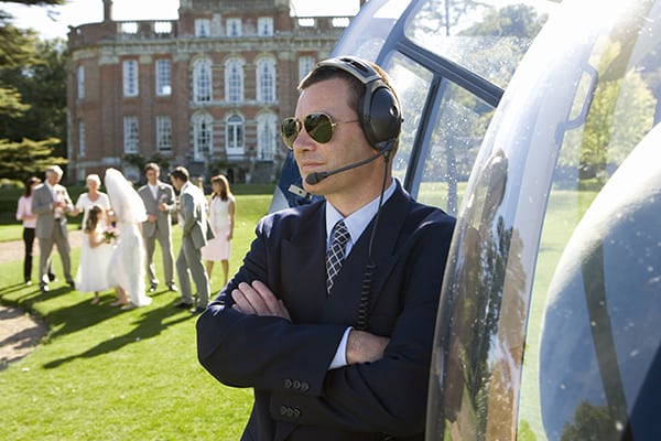 Special Event Security Guard standing by Helicopter