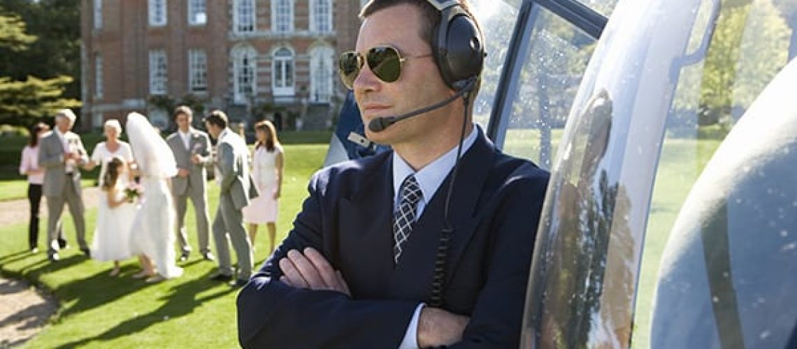 Special Event Security Guard standing by Helicopter